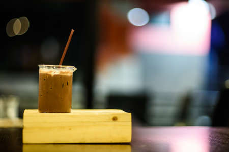 closeup of a cup of coffee at coffee shop backgroundの写真素材
