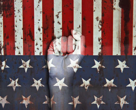 picture of a fist painted in colors of american flagの写真素材