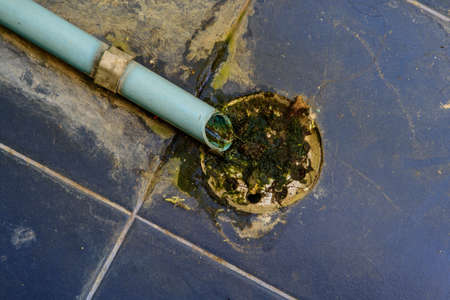 old drain pipe and rusty sieve of culvert at dorm