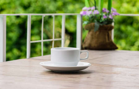 cup of coffee on table in cafeの写真素材