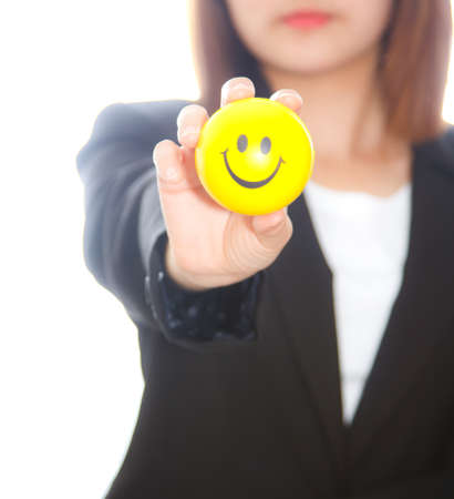 business woman sending smiling ball on white background. Focus at smiling ballの写真素材
