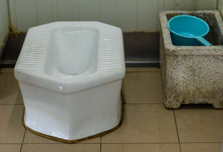Toilet bowl in a thai style bathroom.の写真素材