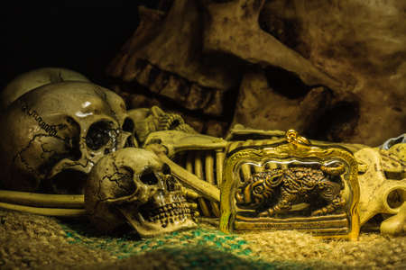 small buddha with human skull still life backgroundの写真素材