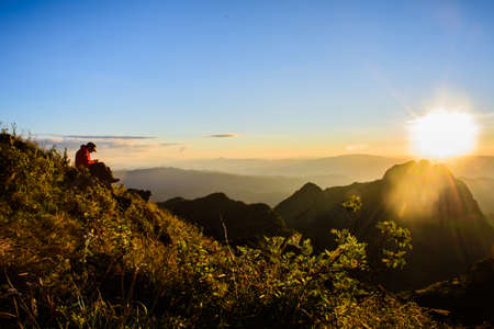 CHIANGMAI, THAILAND - 16 NOVEMBER 2015- Editorial: Silhouette of a man praying outside at beautiful landscapeのeditorial素材