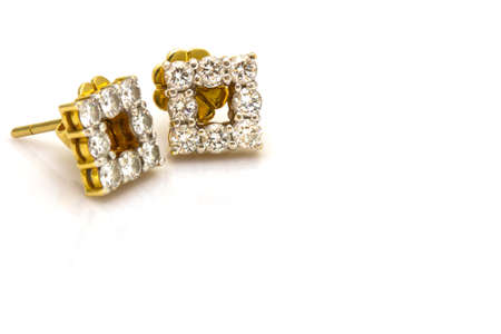 A couple of diamond earrings on whiteの写真素材