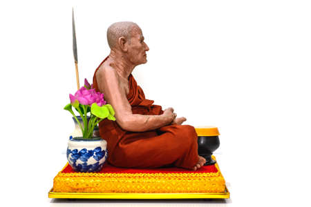 BANGKOK, THAILAND - 30 SEPTEMBER 2015- Editorial: Monks pray at the foot of deitiesのeditorial素材