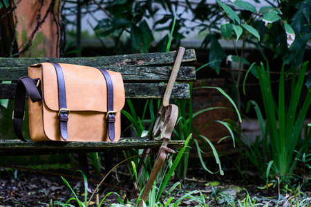 Brown Leather laptop bag corporate on old woden chairの写真素材