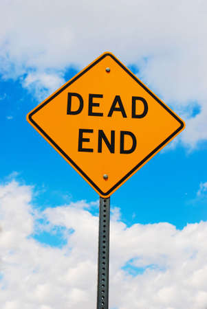 Simple dead end sign with a partly cloudy backdropの写真素材