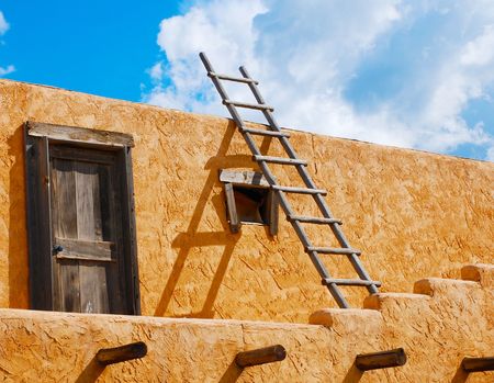 Ladder on a Southwest-style stucco building in New Mexicoの写真素材