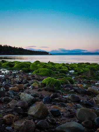 Scottish Sunset with mossy rocksの写真素材