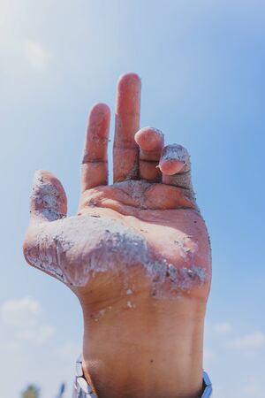paint stained hands in the afternoon sun