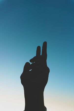 sunset backlit handの写真素材
