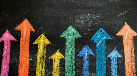 Colorful arrows pointing up on blackboard. Business success concept.の素材