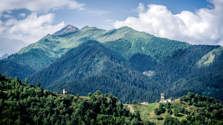 Small village looking at Greater Caucasus mountains in Ushguli region, Georgiaのeditorial素材
