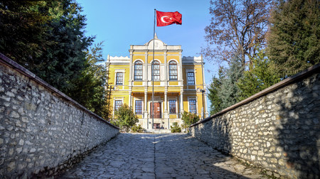 Safranbolu, Turkey - January 20, 2013: Historical government office building in Safranbolu village with Turkish flag.のeditorial素材