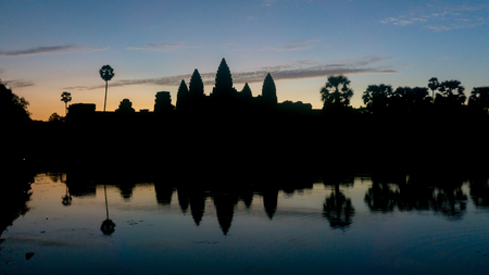 Siem Reap, Cambodia, December 06, 2015: Silhouette of Angkor Wat temple in Cambodia during sunrise. Angkor Wat is one of the famous tourist attraction in the world, located at Cambodia.のeditorial素材