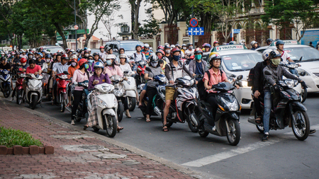 Saigon, Vietnam - November 28, 2015: Road traffic in Saigon, Vietnam. In the biggest city in Southern Vietnam are more than 4 mil. motorbikes, the traffic is often congestedのeditorial素材