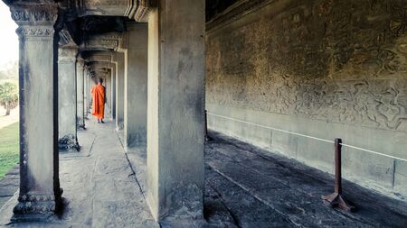 Siem Reap, Cambodia, December 06, 2015: Monk walking at a corridor in Angkor Wat, Cambodiaのeditorial素材