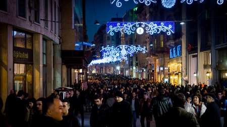 Istanbul, Turkey - March 17, 2012: People on Istiklal Street, Taksim at night. Istiklal Street is the most popular destination of Istanbul for shopping and entertainment.のeditorial素材