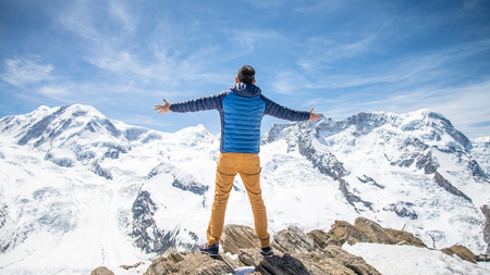 ZERMATT, SWITZERLAND - May 16. 2017:  Man on the peak of the mountain, leader successful victory concept.のeditorial素材