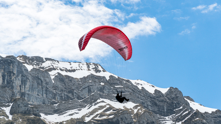 Switzerland, May 2017 - Paragliding in the Alps mountainsのeditorial素材
