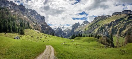 Seealpsee, Switzerland - May 2017: Seealpsee lake with the Swiss Alps in the background, Appenzeller Land, Switzerlandのeditorial素材