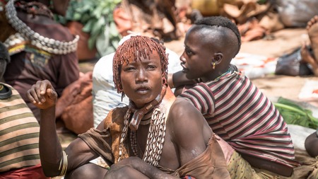 Omo Valley, Ethiopia - September 2017: Unidentified women from Hamar tribe at local village market...