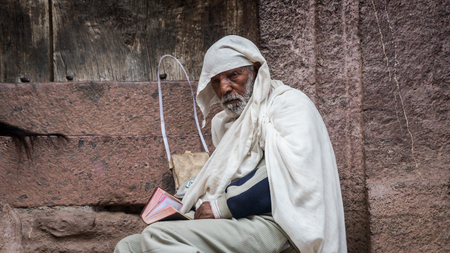 Lalibela, Ethiopia - September 2017: Pilgrim at one of the old rock churches from Lalibela