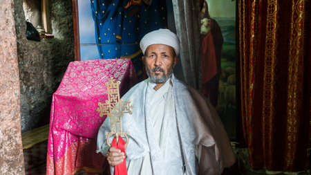 Lalibela, Ethiopia - September 2017: Unidentified priest at one of the old rock churches from...