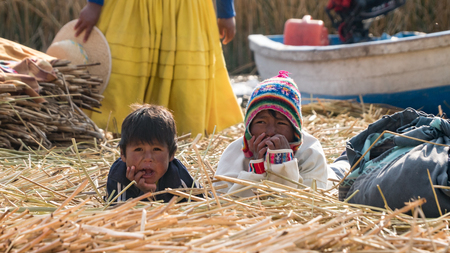 Puno, Peru - September 2017: Unidentified people at the Floating island Isla Flotante, Titicaca lake, Peruのeditorial素材