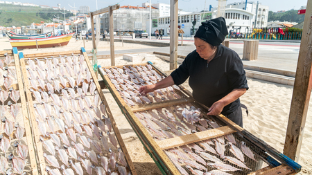 Nazare, Portugal - April 2018: Traditional fish-drying on the beach of Nazare, Portugal. Nazare is a fishermen village on the Atlantic coast of Portugalのeditorial素材