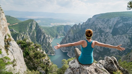 Woman overlooking Sahinkaya Canyon in Vezirkopru district of Samsun with Kizilirmak river and lake,Turkey.のeditorial素材