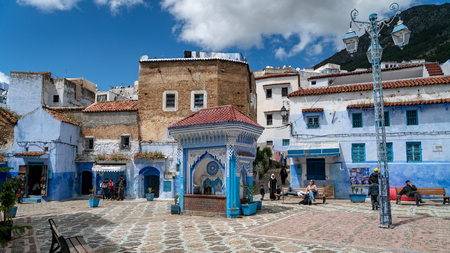 Chefchaouen, Morocco - April 2018: Chefchaouen medina center with unidentified people, blue city skyline on the hill, Moroccoのeditorial素材