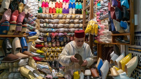 Fez, Morocco - April 2018: Unkown man selling slippers and shoes in traditional store in Fes, Moroccoのeditorial素材