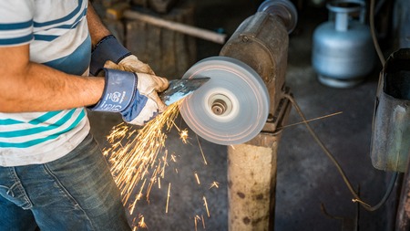Adiyaman, Turkey - July 2018: Tailor working on traditional handycrafts in the Adiyaman city historical old Oturakci bazaar inside the old city, Turkeyのeditorial素材