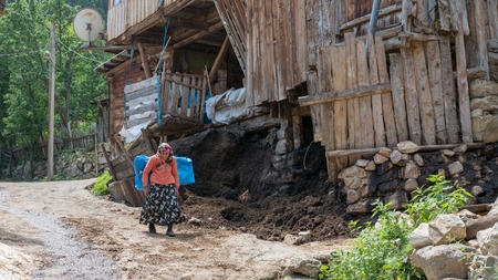Artvin, Turkey - July 2018: Unidentified woman in local outfit walking in Maden Village , Savsat, Artvin, Turkeyのeditorial素材