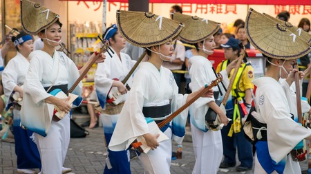 Tokyo, Japan - August 2018: Japanese performers dancing traditional Awaodori dance in the famous Koenji Awa Odori festival.のeditorial素材