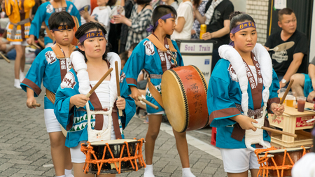 Tokyo, Japan - August 2018: Japanese children dancing traditional Awaodori dance in the famous Koenji Awa Odori festival.のeditorial素材