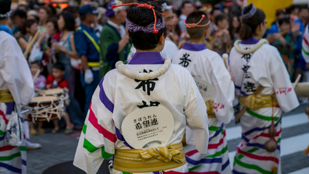 Tokyo, Japan - August 2018: Japanese performers dancing traditional Awaodori dance in the famous Koenji Awa Odori festival.のeditorial素材