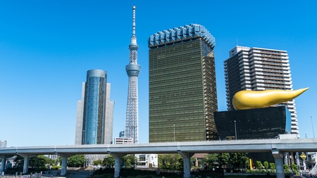 Tokyo, Japan - August 2018: Asahi Breweries headquarters building with the Asahi Flame with Tokyo...