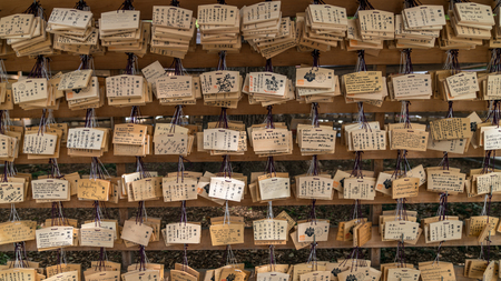 Tokyo, Japan - August 2018: Wooden prayer plaques hanging in the Meiji-jingu Temple, a Shinto Shrine in busy city of Tokyo.のeditorial素材