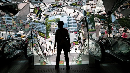Tokyo, Japan - August 2018: Silhouette Male traveler at Omotesando Tokyo Plaza building in Harajuku, Tokyo, Japan. Tokyu Plaza is a fashion theme park shopping mall for the trendiest fashion.のeditorial素材
