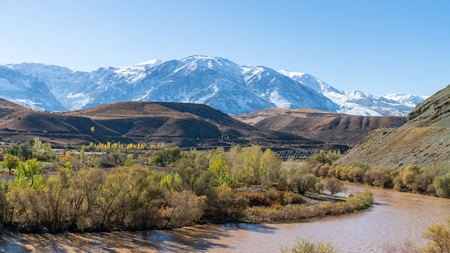 View of a valley with snow capped mountains and River Euphrates near Erzincan, Turkeyの写真素材