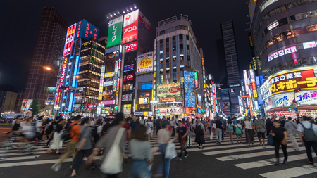 Tokyo, Japan - August 2018: Long exposure photo of people at Kabukicho in the Shinjuku district. The area is an entertainment and red-light districtのeditorial素材