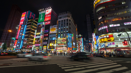 Tokyo, Japan - August 2018: Long exposure photo of people at Kabukicho in the Shinjuku district. The area is an entertainment and red-light districtのeditorial素材