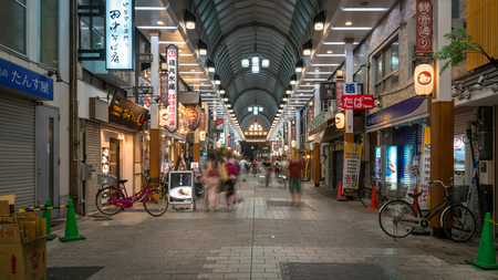 Tokyo, Japan - August 2018: Unidentified crowd shopping at Nakamise street for souvenirs at Asakusa Sensoji temple in the eveningのeditorial素材