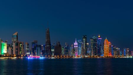 Doha, Qatar - February 2019: Doha Qatar skyline cityscape with skyscrapers at nightのeditorial素材
