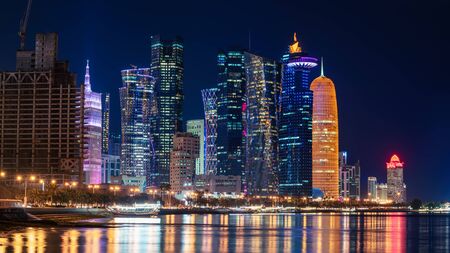 Doha, Qatar - February 2019: Doha Qatar skyline cityscape with skyscrapers at nightのeditorial素材