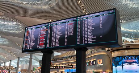 Istanbul, Turkey - July 2019: Flight information time table in new Istanbul Airport displaying the...