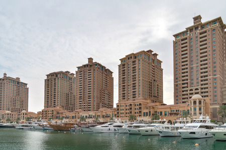 Doha, Qatar - February 2019: Residential buildings and marina at the Pearl areaのeditorial素材